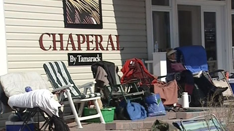 Lawn chairs are set up outside the Tamarack Homes sales office in Orleans, Tuesday, April 13, 2010.