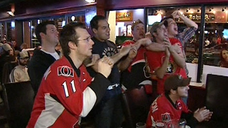 Ottawa Senators fans celebrate on Sens Mile on Elgin Street, Wednesday, April 14, 2010.