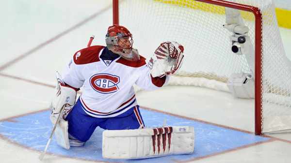 The puck gets by Montreal Canadiens goalie Jaroslav Halak (41), of Slovakia, for a goal by Washington Capitals center Nicklas Backstrom, of Sweden, during the overtime period of Game 2 of the NHL hockey playoffs, Saturday, April 17, 2010, in Washington. The Capitals won 6-5 in overtime. (AP Photo/Nick Wass)