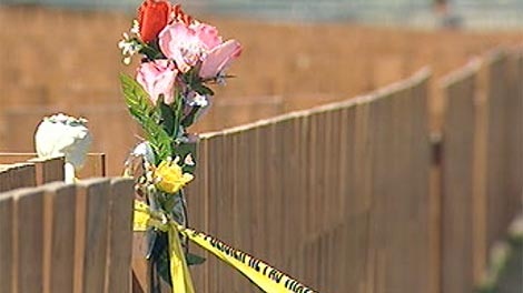 A number of flowers and memorials for 34-year-old Ricky Lathlin have been set up at the Gilbert Park housing complex. 
