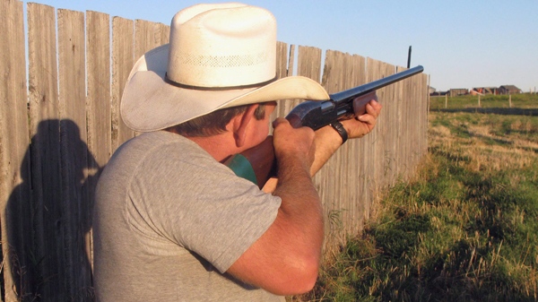 Wayne H. shoots a gun on a ranch near High River, Alta., on Sept.10, 2008. (THE CANADIAN PRESS / Bill Graveland)