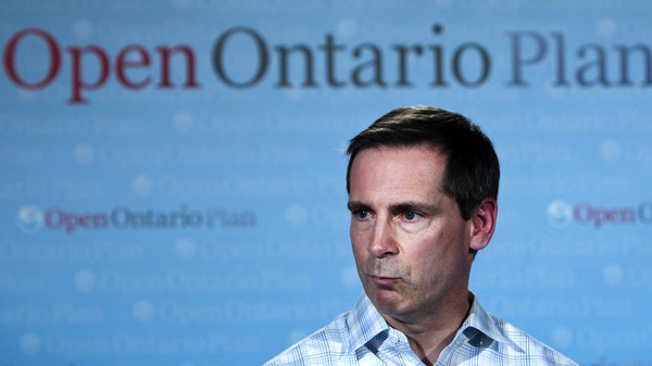 Ontario Premier Dalton McGuinty, right, speaks to the media about the postponed controversial sex ed curriculum after participating in Earth Day events at the Tecumseh Public School in London, Ont., on Thursday, April 22, 2010. (Nathan Denette / THE CANADIAN PRESS)