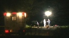 Police investigators work under lights after discovering two bodies in a car parked in Pickering early in May 2009. (file)