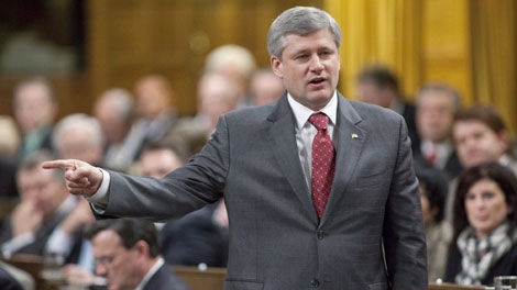 Prime Minister Stephen Harper gestures as he stands in the House of Commons on Parliament Hill during Question Period in Ottawa on Wednesday, April 21, 2010. (THE CANADIAN PRESS/Pawel Dwulit)