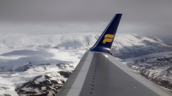 The wing of an Icelandair flight is seen as it leaves Akureyi Airport in Akureyi, Iceland on Saturday, April 24, 2010. (AP / Carolyn Kaster)
