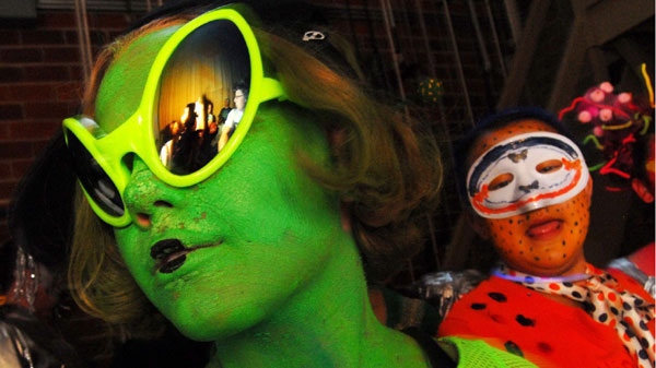 In this file photo, people dressed as aliens wait backstage for their turn at the costume contest at Pearson Auditorium during the UFO Festival on Saturday July 5, 2008 in Roswell, N.M. (AP Photo/Roswell Daily Record, Mark Wilson)