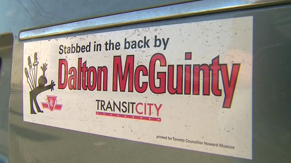 The bumper sticker accuses Premier Dalton McGuinty of stabbing Toronto in the back by delaying some Transit City funding.
