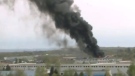 Dark smoke was spotted across the city as fire crews tried to gain control of a massive fire at a car recycling plant in Ottawa's east end, Saturday, May 1, 2010.