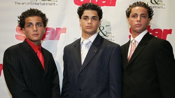 Attending the viewing of the reality television show 'Growing up Gotti,' John Gotti Agnello, left, Frank Gotti Agnello, and Carmine Gotti Agnello, all grandsons of the late mob boss John Gotti, pose for photographers Tuesday, July 27, 2004, in New York. (AP / Julie Jacobson)
