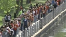 Thousands of students gather along the Rideau Canal to participate in a giant bear hug in Ottawa, Friday, May 7, 2010.