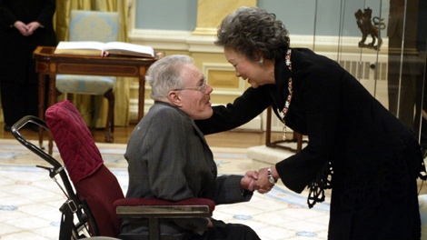 Governor General Adrienne Clarkson congratulates social activist and wheelchair athlete sports administrator Gary McPherson, after investing him into the Order of Canada, at a ceremony in Ottawa Feb 20, 2004. (Tom Hanson / THE CANADIAN PRESS)