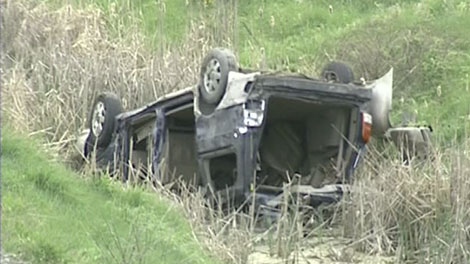 A two-car crash caused a van to flip in the ditch trapping a woman in her vehicle on Highway 417, Tuesday, May 11, 2010.