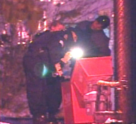 Investigators found a gun inside a garbage can behind a strip mall near the fatal shooting on Friday, Nov. 23, 2007.