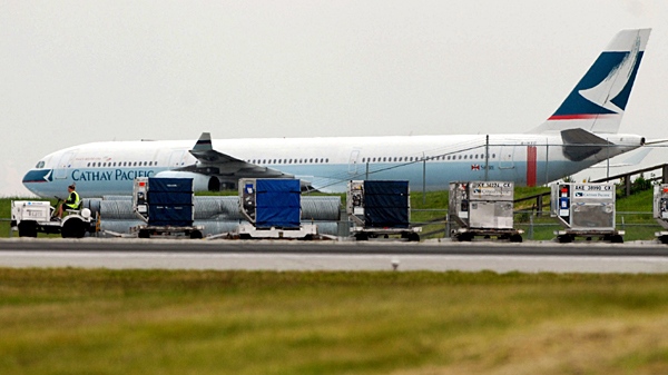 A Cathay Pacific passenger plane sits on the tarmac at the Vancouver International Airport on Saturday May 15, 2010. (Don MacKinnon / THE CANADIAN PRESS)