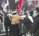This image, taken from amateur video, shows a Toronto police officer punching a protester on Nov. 8, 2003.