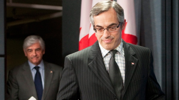 Minister of Industry Tony Clement(right) and Minister of Foreign Affairs Lawrence Cannon arrive for a news conference about the ongoing efforts to establish a global bank tax in Ottawa, Tuesday May 18, 2010. (Adrian Wyld / THE CANADIAN PRESS)