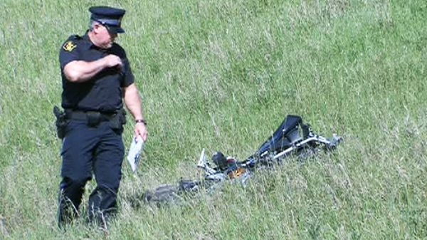 Police investigate the area where a motorcyclist was seriously injured  after his bike went airborne over the Highway 427 overpass and onto Sherway Drive on Thursday, May 20, 2010.