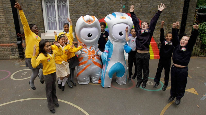 The Olympic mascot Wenlock, left, and the Paralympic mascot Mandeville, pose for photographs with children, as they are unveiled to the media as the mascots for London 2012, at a school in London, Wednesday, May 19, 2010. (AP / Matt Dunham)