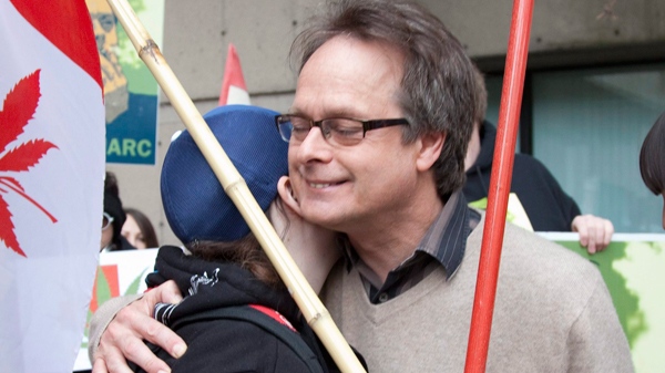 Marc Emery, the self-describe "Prince of Pot", right, receives a hug from a supporter outside the B.C. Supreme Court in Vancouver, Monday, May 10, 2010. ( THE CANADIAN PRESS/ Jonathan Hayward)