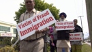 Protestors march in Surrey, B.C., against the lack of regulation in the immigration consulting industry. May 22, 2010. (CTV)