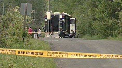 Police set up a command post in Ontario's cottage country after human remains were found in two different locations on Saturday, May 23, 2010.