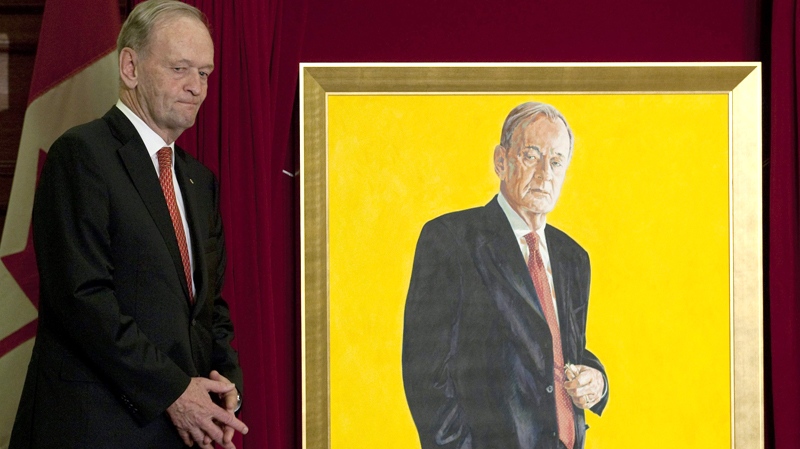 Former prime minister Jean Chretien stands next to his official portrait at its unveiling in Ottawa on Tuesday, May 25, 2010. (Adrian Wyld / THE CANADIAN PRESS)  