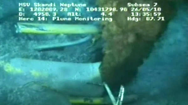 This image from the live video shows oil pouring out of the underwater oil well in the Gulf of Mexico, Wednesday afternoon, May 26, 2010.