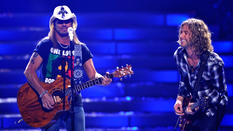 In this publicity image released by Fox, Brett Michaels and Idol finalist Casey James perform perform during the "American Idol" finale at the Nokia Theatre in Los Angeles, Wednesday, May 26, 2010. (AP / FOX, Vince Bucci)