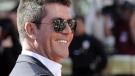 Simon Cowell arrives at the 'American Idol' finale on Wednesday, May 26, 2010, in Los Angeles. (AP / Chris Pizzello) 
