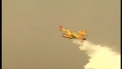 Water bomber planes like the one seen here were used to battle brush fires in the Pontiac Wednesday, May 8, 2013.
