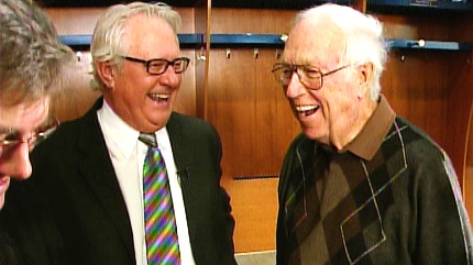 Retiring play-by-play announcer for the Edmonton Oilers Rod Phillips shares a joke with former CFRN colleague Al McCann.  Phillips will be giving up the microphone for after calling 10 "classic" games for the team this upcoming season.