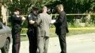 Police investigate after a man died from a stab wound in the city's west end, on Saturday, May 29, 2010.
