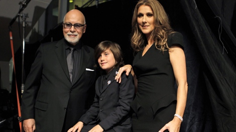 Celine Dion, right, poses with her husband Rene Angelil, left, and son Rene Charles Angelil, center, as they arrive for the premiere of the film "Celine: Through the Eyes of the World" in Miami Beach, Fla. Tuesday, Feb. 16, 2010. (AP / Lynne Sladky)