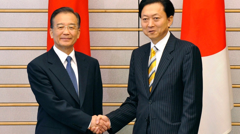 Chinese Premier Wen Jiabao, left, shakes hands with his Japanese counterpart Yukio Hatoyama prior to their talks at the latter's official residence in Tokyo on Monday, May 31, 2010. (AP / Kazuhiro Nogi)