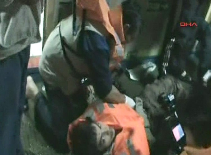 This video image released by the Turkish Aid group IHH on Monday, May 31, 2010 purports to show an injured passenger on a Turkish ship, part of an aid convoy heading to the Gaza Strip, after Israeli soldiers boarded the vessel in international waters off the Gaza coast. (AP / IHH via APTN) 