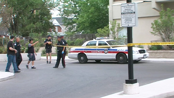 Toronto police arrive at the scene of the fatal stabbing in the area of Jane Street and Lawrence Avenue West in west-end Toronto, Monday, May 31, 2010