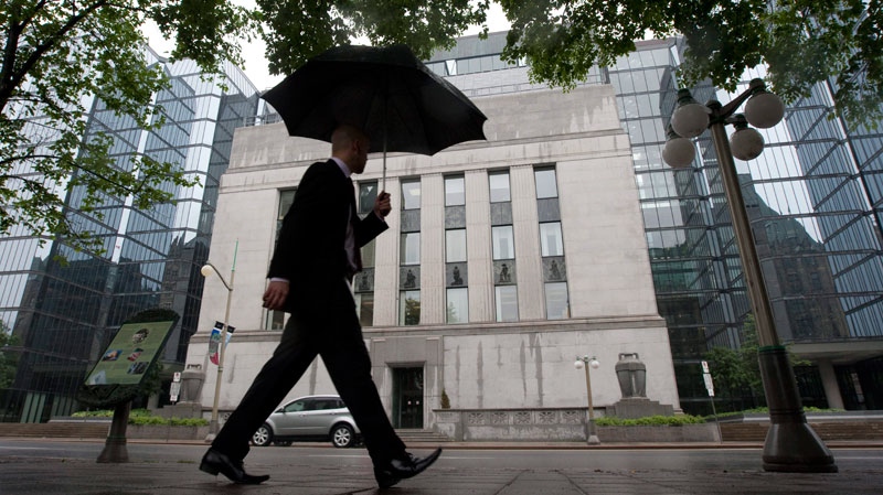 A pedestrian walks past the Bank of Canada in Ottawa, Canada Tuesday June 1, 2010. (Adrian Wyld / THE CANADIAN PRESS)
