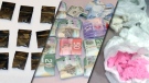 Police show off drugs and cash seized in Project Woody. The dark baggies contain crack cocaine ranging from $20 to $80. On the far right, police display �pink crack.� Image courtesy: Sgt. Roley Campbell, Ottawa Police Street Crime Unit