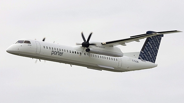 A Porter Airlines Bombardier Q400 turboprop does a flyby at the Billy Bishop city centre airport in Toronto in this Aug. 29, 2006 photo. (THE CANADIAN PRESS/Adrian Wyld)