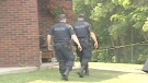 Ontario Provincial Police search for evidence after a woman was found dead at a Renfrew apartment, Monday, May 31, 2010.