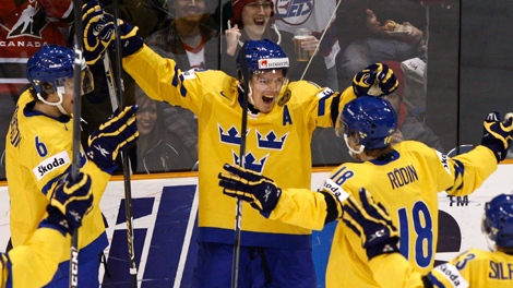 Team Sweden Anton Lander celebrates his second goal against Team USA with teammates Peter Andersson, left, and Anton Rodin, right during second period semifinal action at the world junior hockey championship Sunday, Jan 3, 2010 in Saskatoon, Sask.. THE CANADIAN PRESS/Nathan Denette