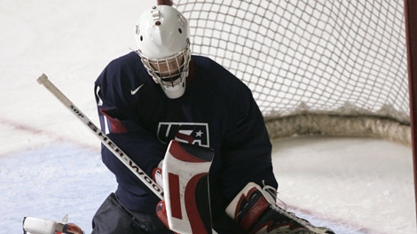 Team USA goalie Cory Schneider makes a toe save during second period action against Team Canada at the World Junior Hockey Championships in Vancouver, B.C. Saturday Dec.31, 2005. (CP PHOTO/Ryan Remiorz)