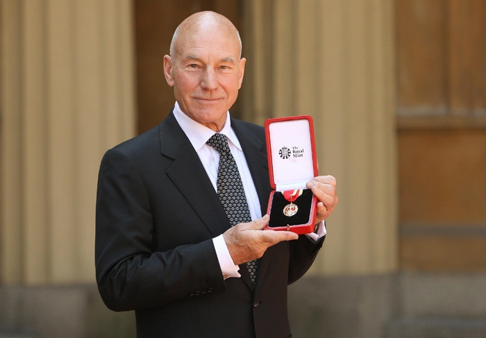 Patrick Stewart poses with the insignia of his knighthood, after receiving the award from the Queen during an investiture at Buckingham Palace in London, Wednesday June 2, 2010. (AP / Dominic Lipinski)