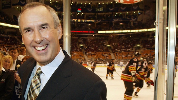 Hockey Night in Canada host Ron Maclean smiles at cheering fans during the pre-game broadcast of the Toronto Maple Leafs and Ottawa Senators in NHL action in Toronto on Saturday Oct. 12, 2002. (Frank Gunn / THE CANADIAN PRESS)