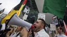 Protesters rally in front of the Israeli consulate in Toronto on Monday, May 31, 2010. (Adrien Veczan / THE CANADIAN PRESS)