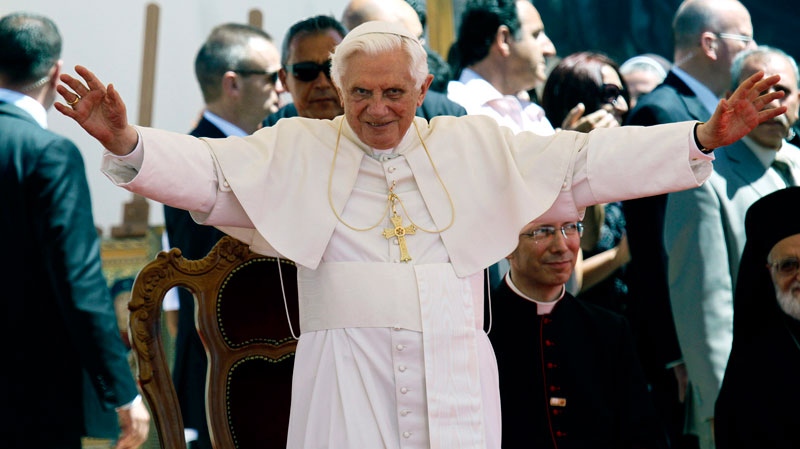 Pope Benedict XVI gestures to the faithful as he arrives for a ceremony at a Saint Maron's School in Anthoupolis, a suburb of Nicosia, Cyprus, Saturday, June 5, 2010. (AP / Petros Karadjias)