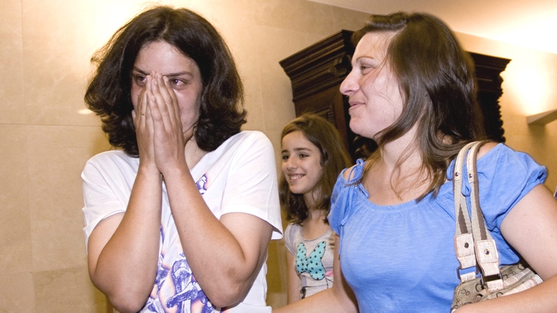 Teresa Pires, left, reacts after getting married with Helena Paixao, right, at a civil registry office on Monday, June 7, 2010 in Lisbon. (AP / Francisco Seco)