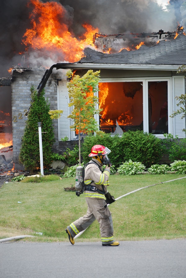 The fire caused by the explosion spread to two neighbouring homes in Napanee, Ont., Tuesday, June 7, 2010. Image courtesy: Seth DuChene, Napanee Beaver