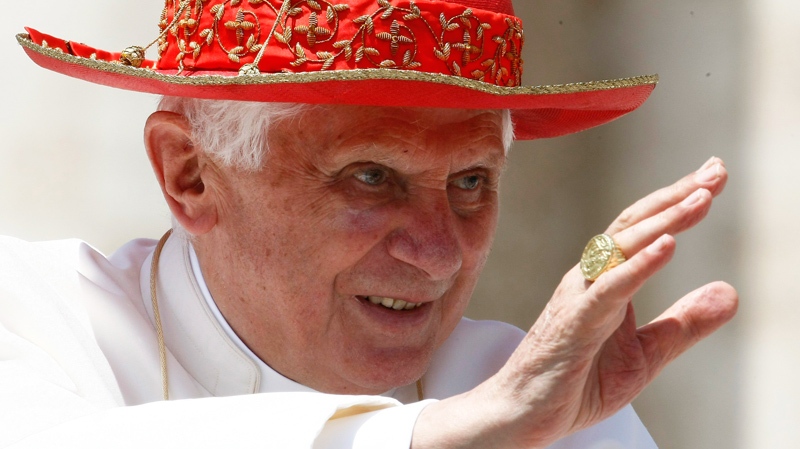 Pope Benedict XVI, wearing his Saturn hat, greets the faithful at the end of his weekly general audience in St. Peter's square at the Vatican, Wednesday, June 9, 2010. (AP / Pier Paolo Cito)