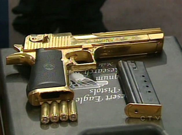 A gun seized during the raids is put on display at police headquarters in downtown Toronto on Friday, Dec. 7, 2007.